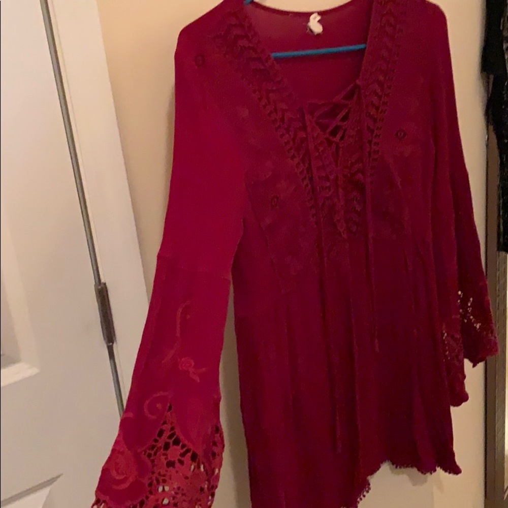 Boutique flared sleeve lace up dress